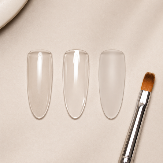 Clear nail tips comparing ACOS base coat, glossy top coat and matte top coat finishes