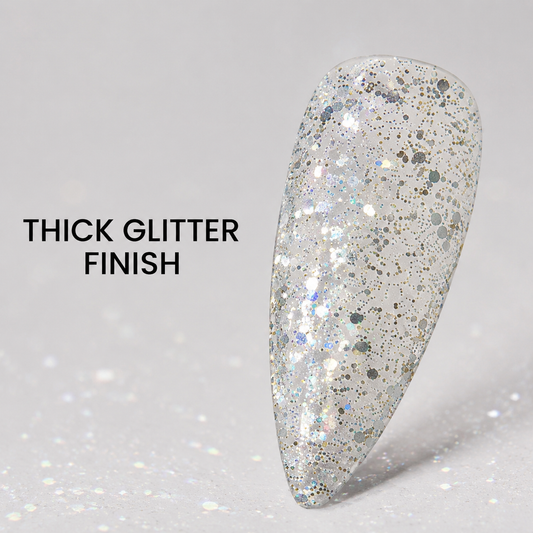 ACOS Thick Glitter 084 finish on a clear almond nail swatch