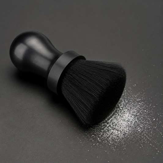 Black neck duster brush with a fine dusting of white barber talc powder