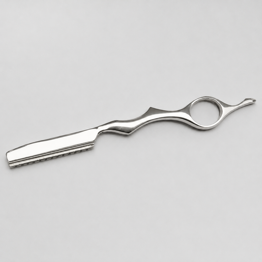 Silver finger-ring hair-shaping razor shown from the reverse side