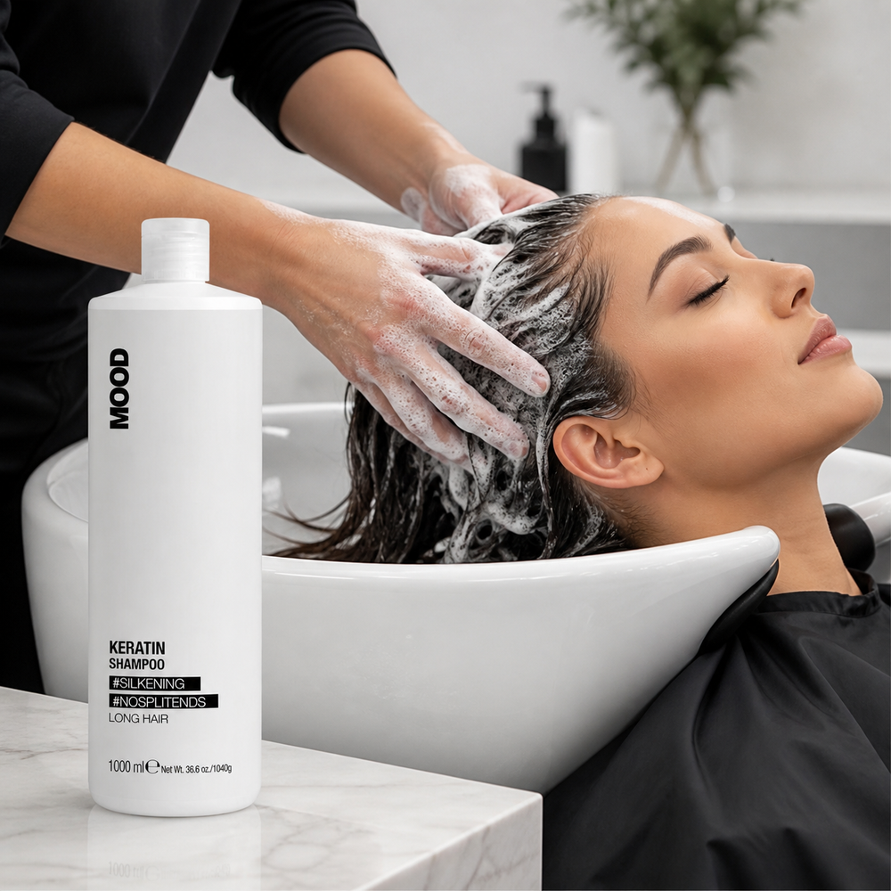 Applying MOOD Keratin Shampoo 1L to long hair in the salon