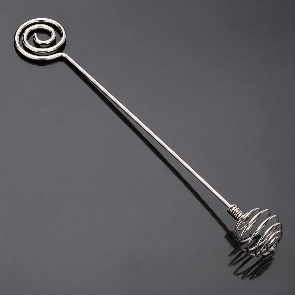 Close detail of the two spiral ends on a stainless steel mixing stick