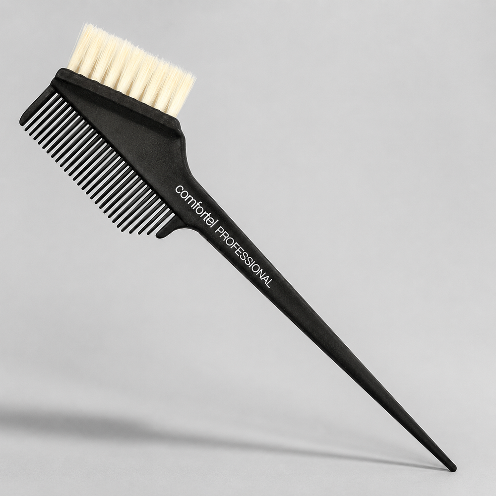 Close view of pale yellow tint bristles, side comb and pointed handle