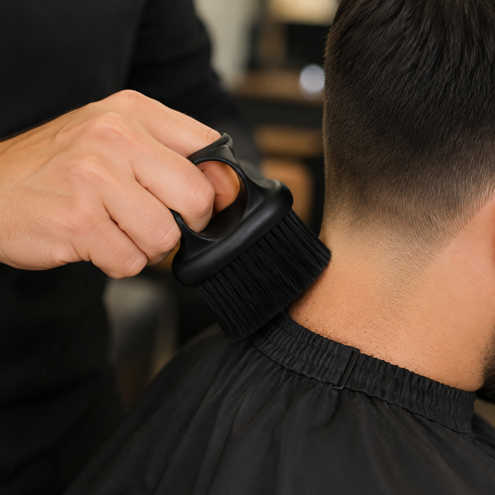 Barber using the finger-ring brush to remove loose neckline hair