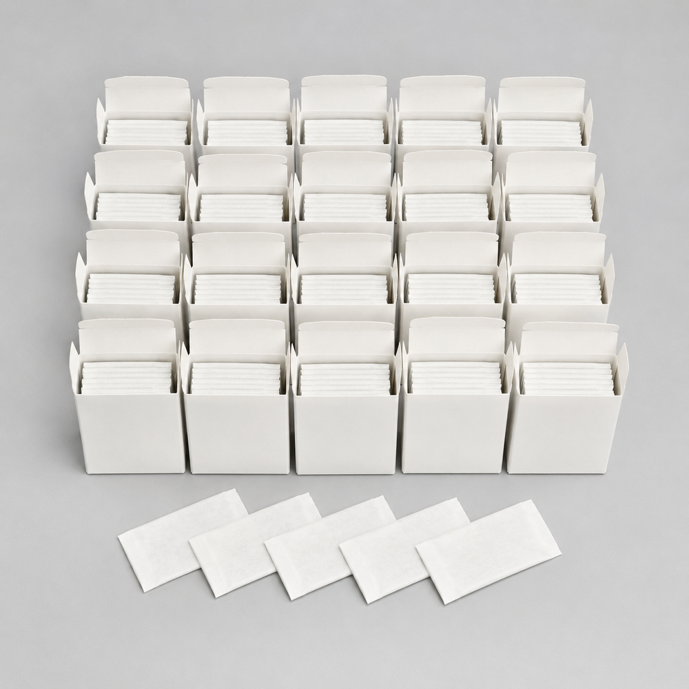 Twenty five-blade tucks and five wrappers representing the 100-blade pack