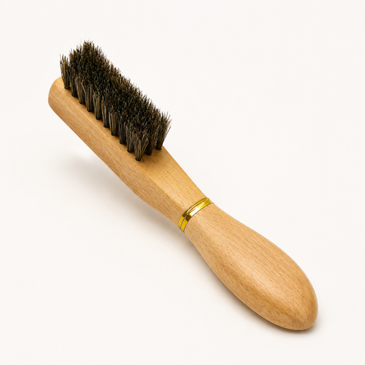 X2678 wooden hair brush with dark bristles and gold band on a warm-white studio background