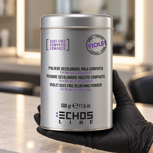 Echos Color Dust-Free Violet Bleach 500g held upright in a gloved hand in a salon, with the front label visible.