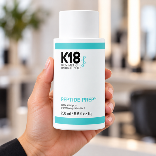 K18 Peptide Prep Detox Shampoo 250ml held in a salon, with the product label visible.