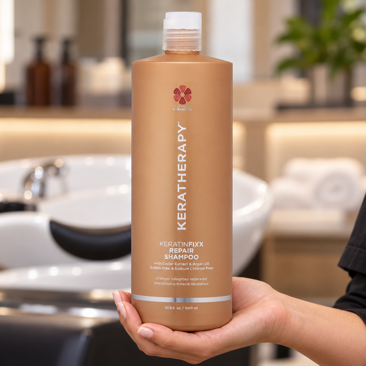 Keratherapy KeratinFixx Repair Shampoo 1L held upright in a salon, with the front label visible.