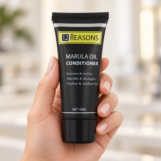 12 Reasons Marula Oil Conditioner 40ml travel tube held with its cap closed and label visible.
