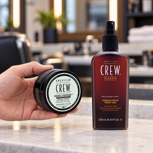 American Crew Boost Powder 20g held beside the Medium Hold Spray Gel 250ml in a salon