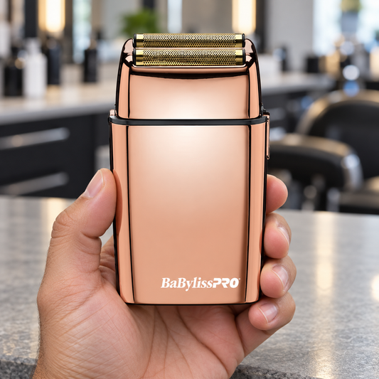 BaBylissPRO FoilFX02 rose gold double foil shaver held upright to show its grip and twin foils.