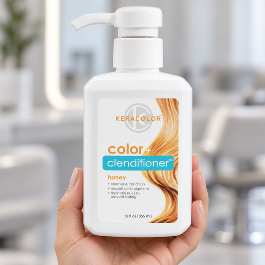 Keracolor Honey Color Clenditioner 355 ml bottle held upright in a salon, showing the honey-blonde label artwork.