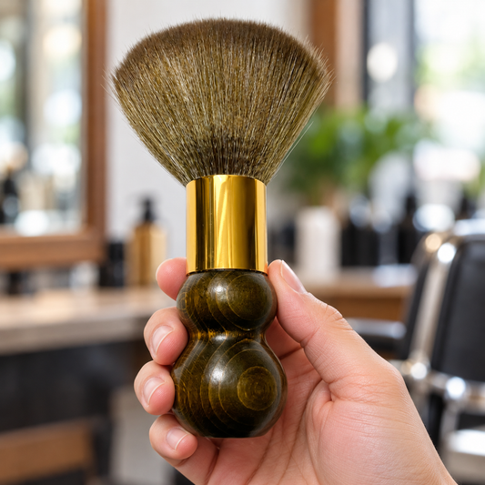 Round neck brush held by its dark wooden handle, showing the gold ferrule and olive-brown bristles.