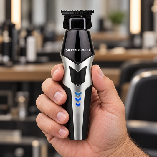 Silver Bullet Zoom trimmer with silver body held to show its T-blade and controls.