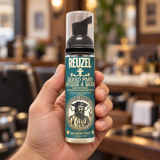 Reuzel Beard Foam 70ml bottle held upright, with the front label and clear cap visible