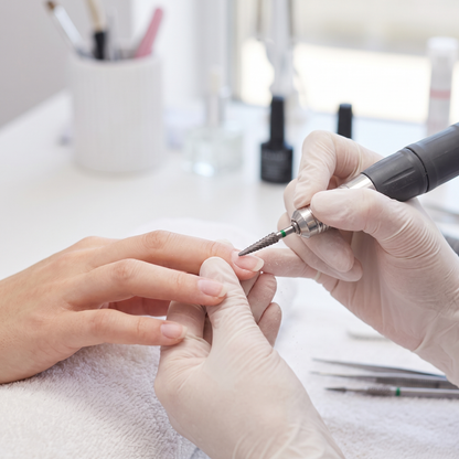 Nail technician using ACOS 3.1mm cone drill bit
