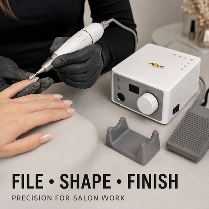 Nail technician filing and shaping with the ACOS CUBE tabletop nail e-file