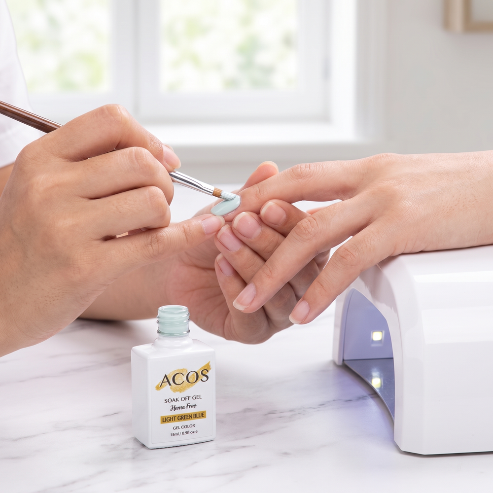 Nail technician applying ACOS Light Green Blue gel
