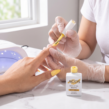 Nail technician applying ACOS Milky Green gel