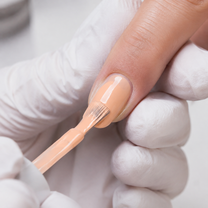 Professional application of ACOS Nude Brown 008 gel colour to a natural nail