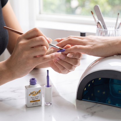 Nail technician applying ACOS Purple gel