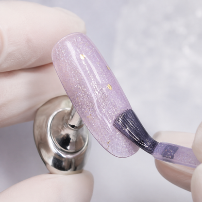 Professional application of ACOS Glitter Purple 089 gel on an artificial nail tip