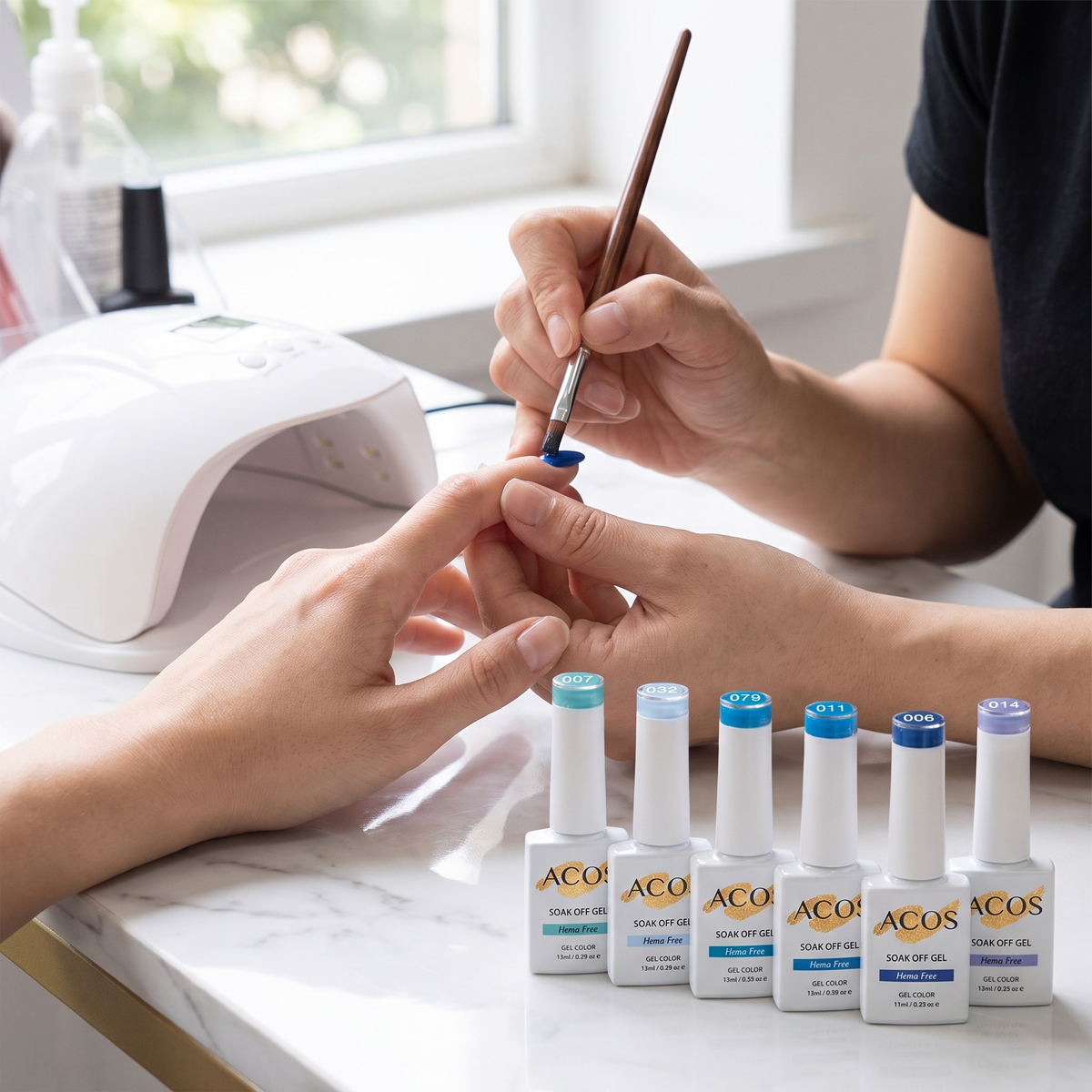 Nail technician applying ACOS blue gel polish