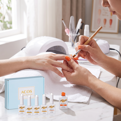 Nail technician applying ACOS orange gel polish