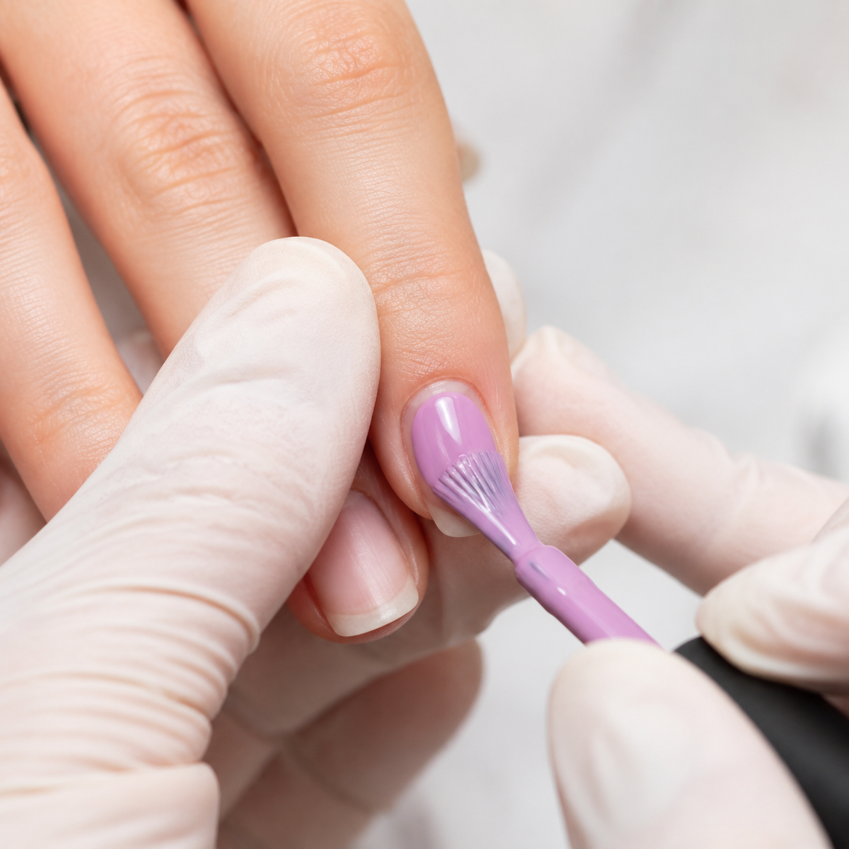 Professional application of ACOS 039 Eggplant Purple gel polish to a natural nail
