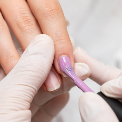 Professional application of ACOS 039 Eggplant Purple gel polish to a natural nail