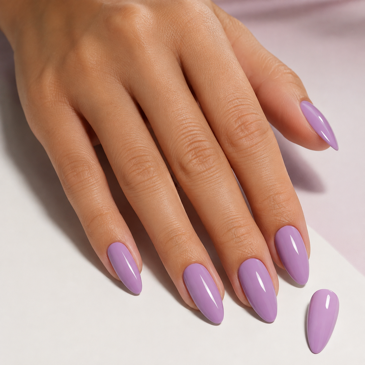Finished glossy manicure in ACOS 039 Eggplant Purple gel polish with matching colour swatch
