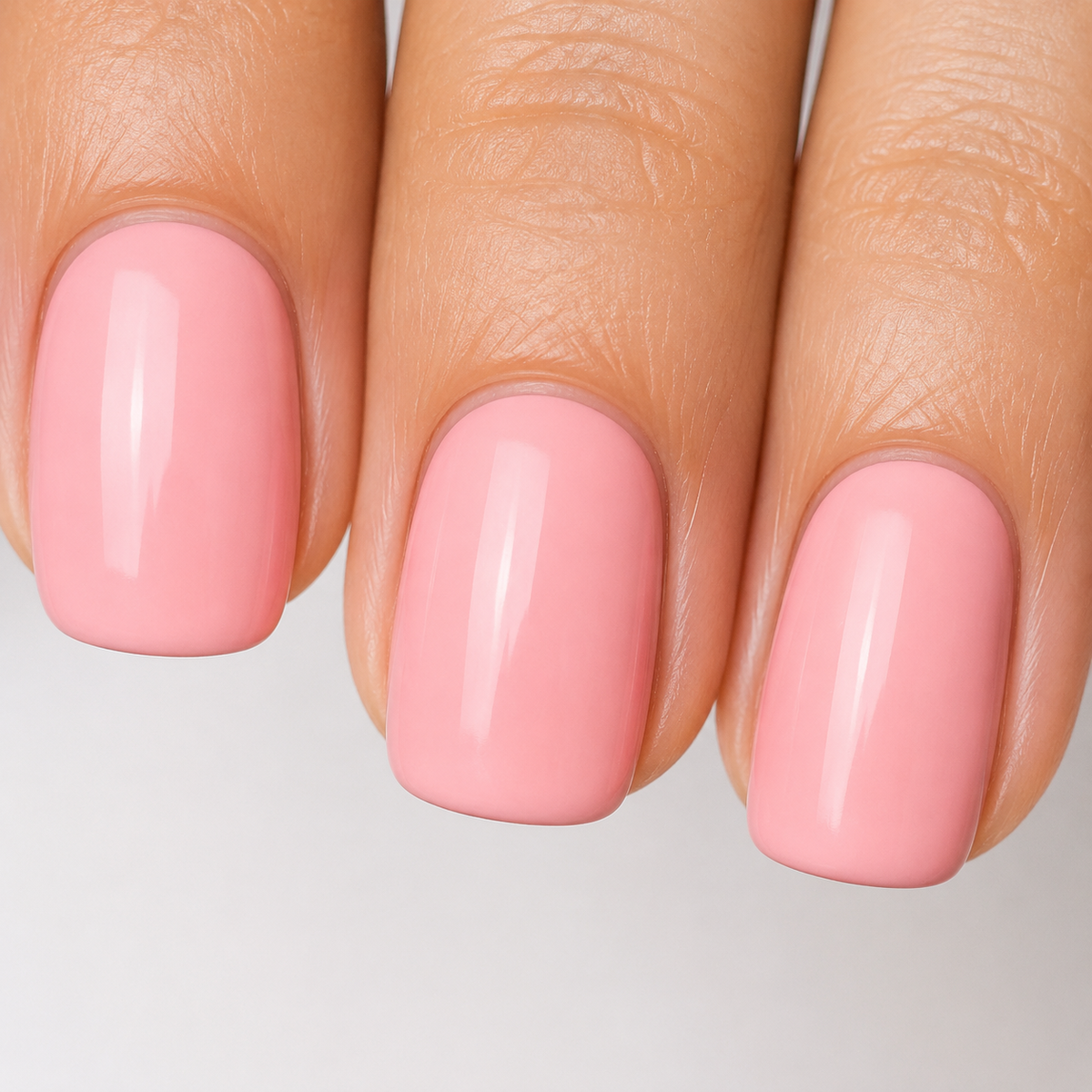 Finished manicure detail in glossy Pink 004 gel polish