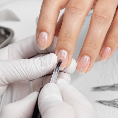 Professional application of ACOS Slim Glitter 085 transparent glitter gel polish