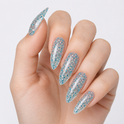 Finished manicure in ACOS Transparent Glitter Blue 079 with a clear blue-glitter finish