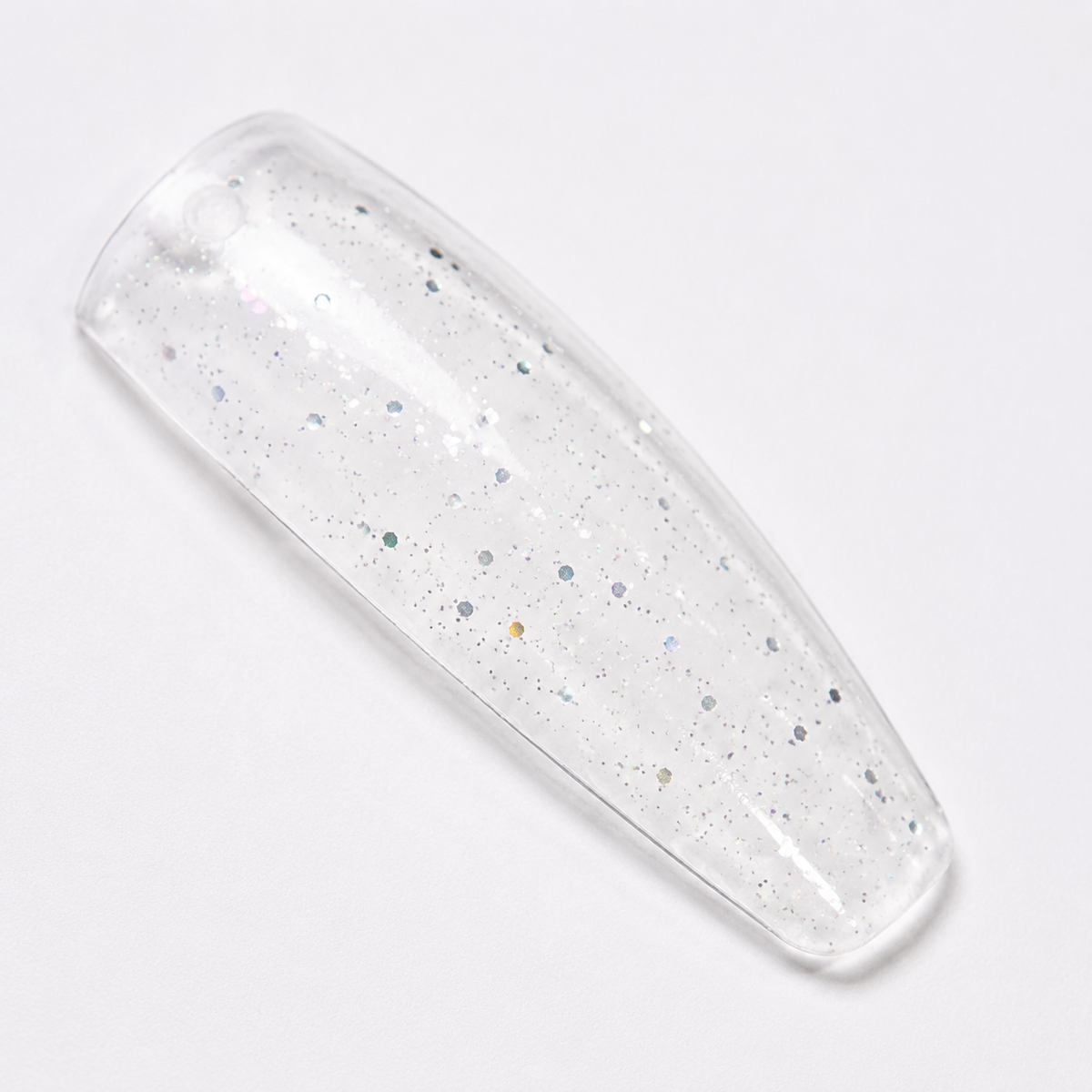 ACOS 083 transparent glitter mix shown on a clear nail swatch tip