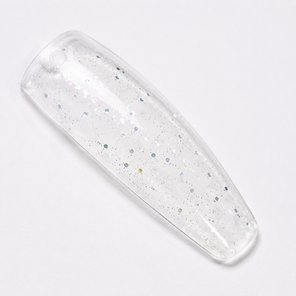 ACOS 083 transparent glitter mix shown on a clear nail swatch tip