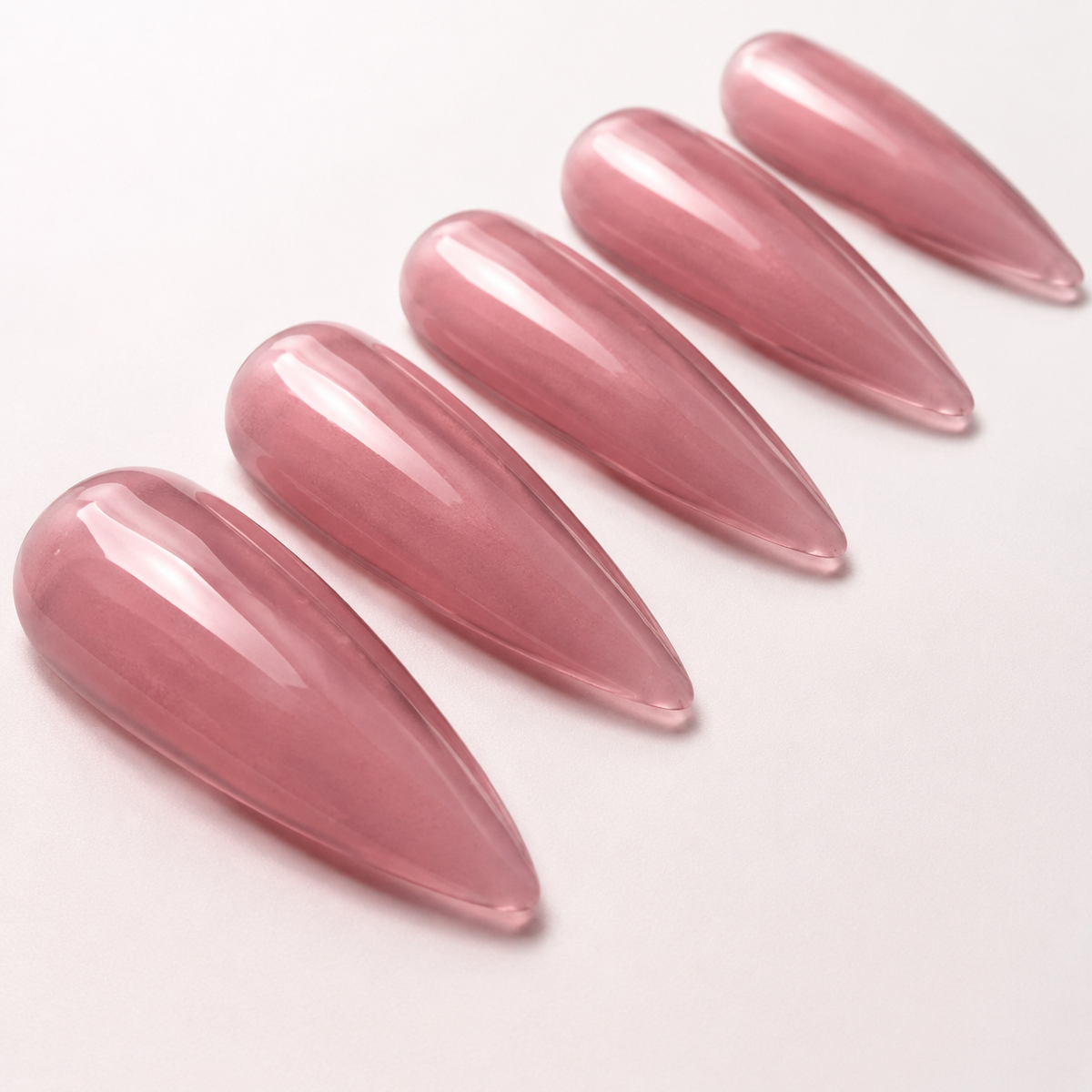 Glossy artificial nail tips showing ACOS Transparent Mulberry 031