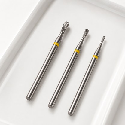 Three ACOS pear-shaped nail drill bit sizes with yellow bands and straight silver shanks