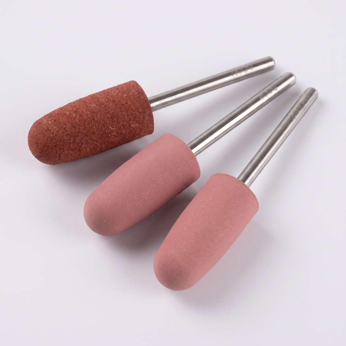 Three ACOS silicone big-head nail drill buffer bits in rust and pink tones
