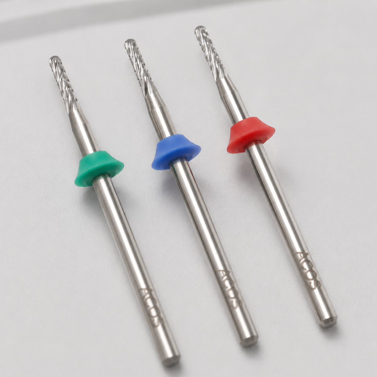 Close detail of ACOS round nail drill bits in coarse, medium and fine grits