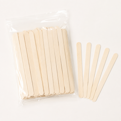AMR 100-pack pale wooden paddle pop sticks in a clear bag with five sticks fanned beside it