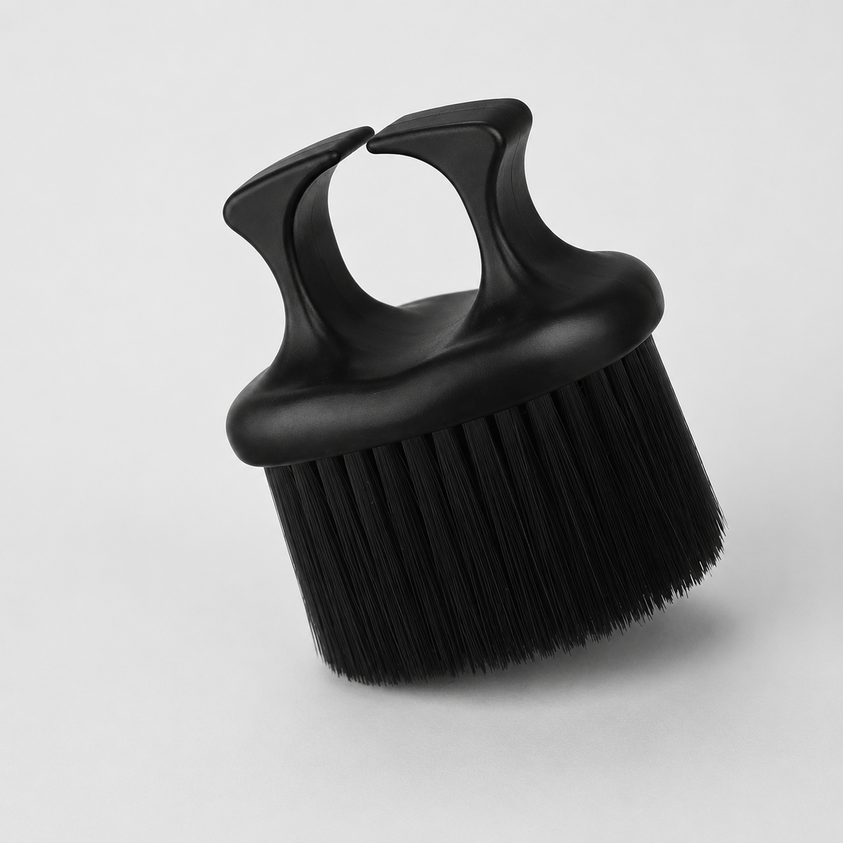 AilieK black finger-ring neck duster brush in angled studio view
