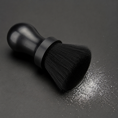 Black neck duster brush with a fine dusting of white barber talc powder