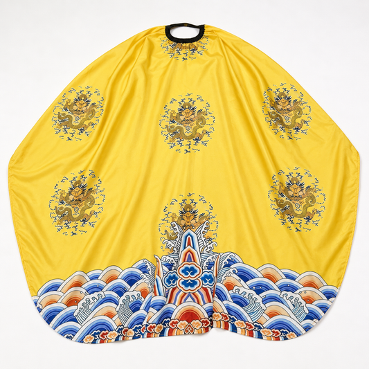 Yellow Dragon barber cape laid flat with seven dragon motifs and blue-orange wave border