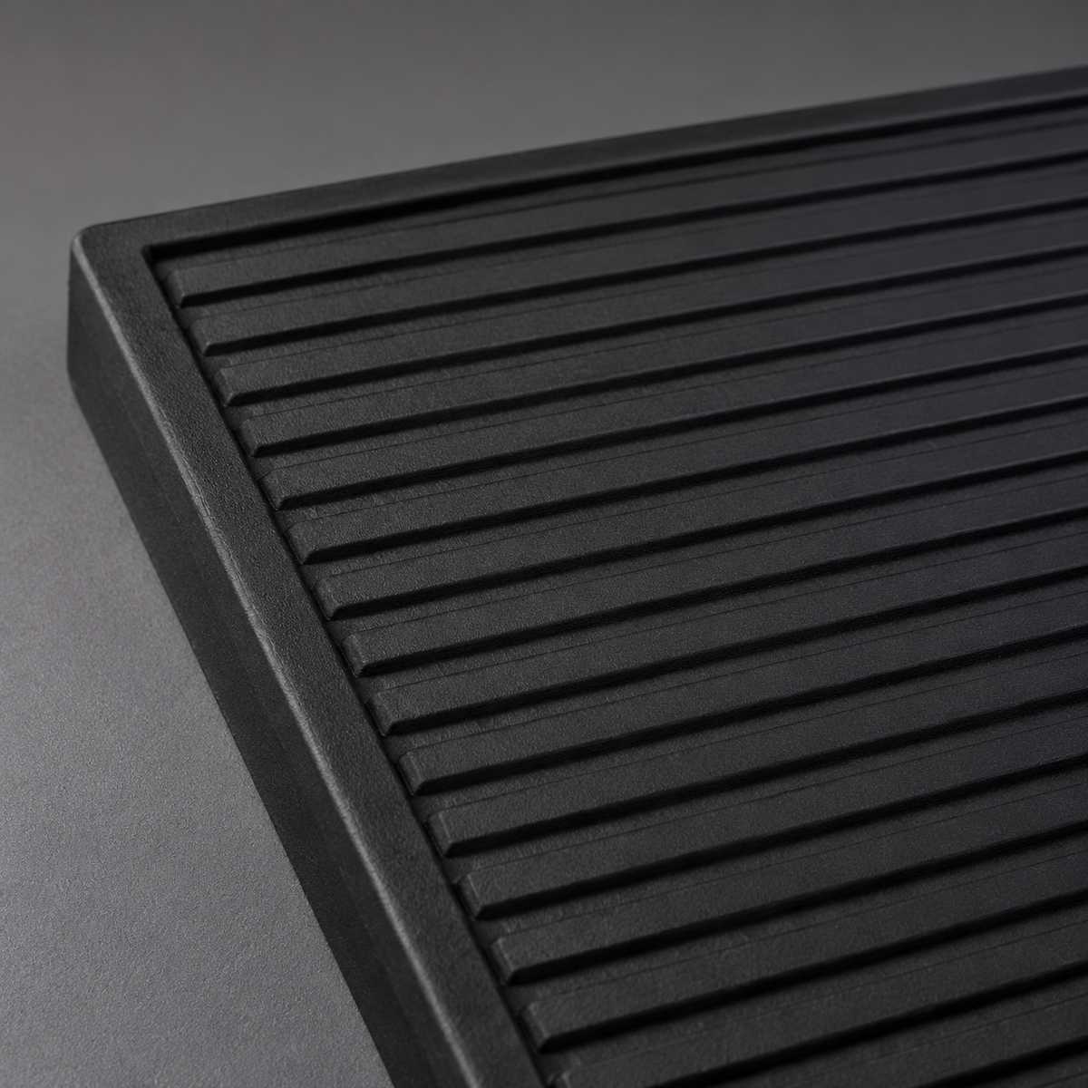 Barbershop 1988 black barber mat ribbed surface and moulded corner detail