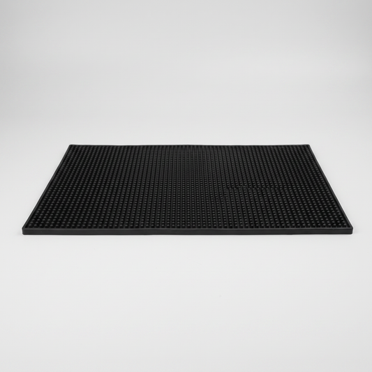 Plain black barber station mat with raised textured surface
