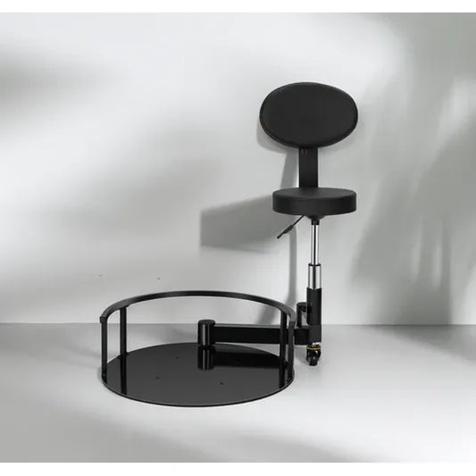 Black padded rotating barber stool system with steel support base and hydraulic post