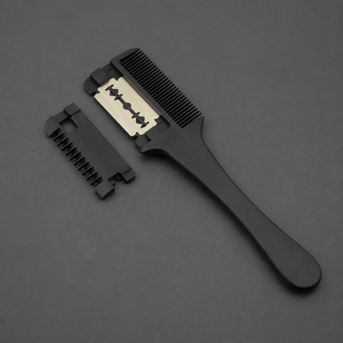 Black Barbertop razor comb with exposed blade and removable toothed cover