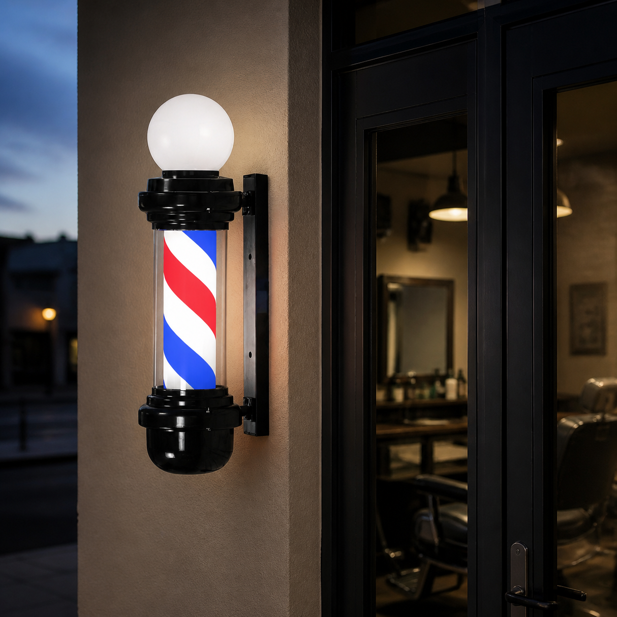 Black Barber Pole with Globe – Red, White & Blue displayed at a barbershop at dusk